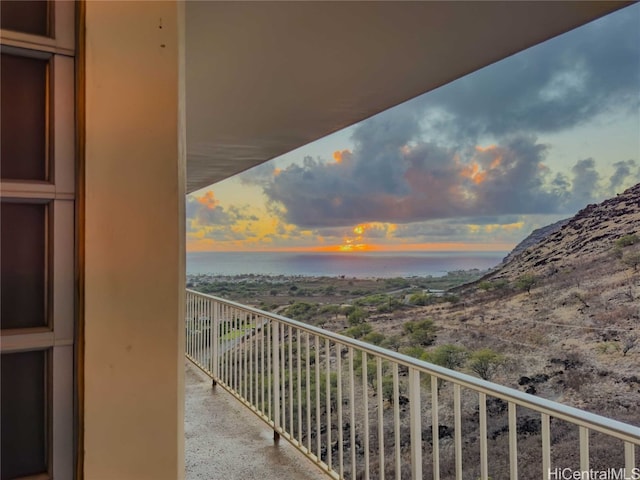 view of balcony at dusk