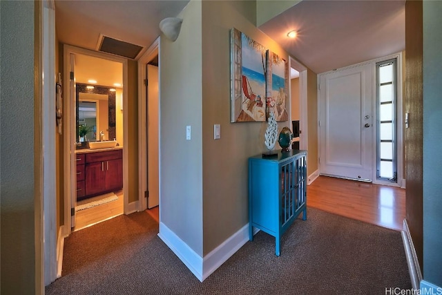 hallway with carpet flooring