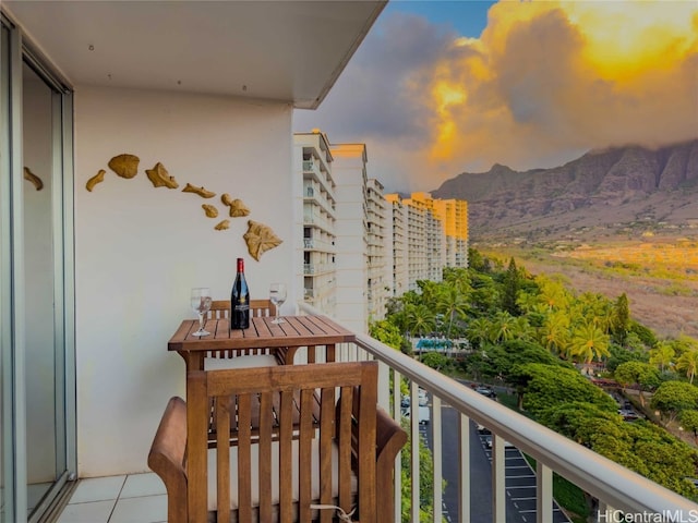 balcony at dusk with a mountain view