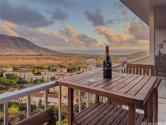 balcony at dusk with a mountain view