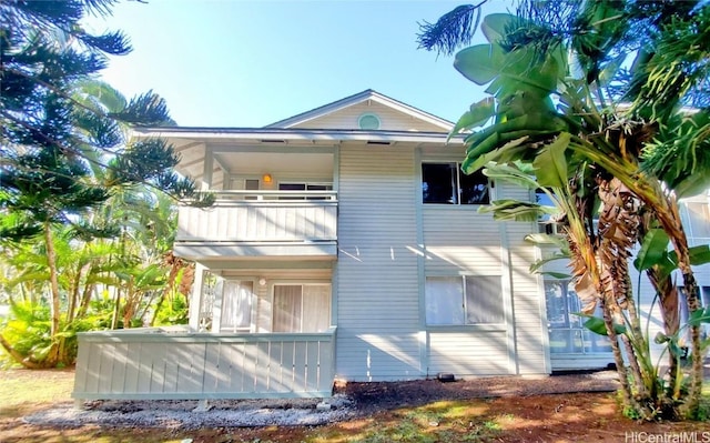 rear view of house with a balcony