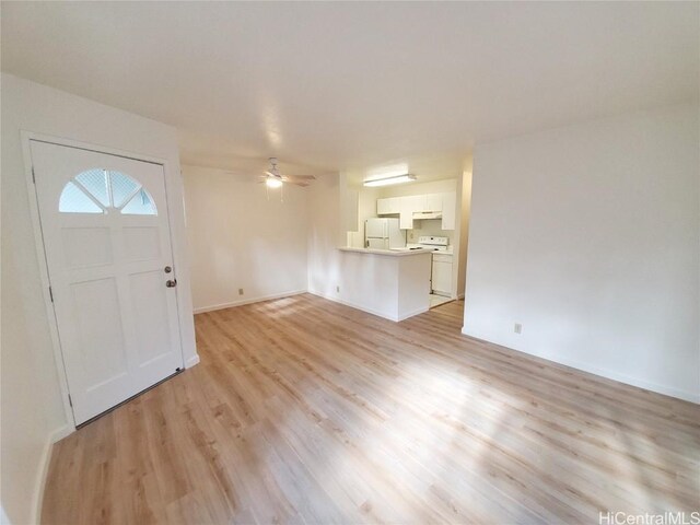 entryway with ceiling fan and light hardwood / wood-style flooring