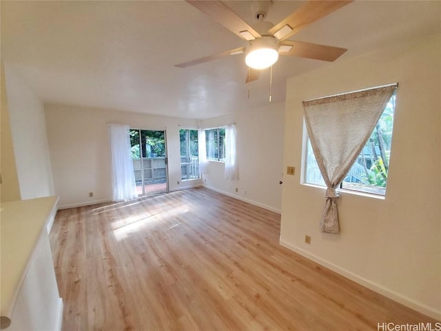 unfurnished room featuring light wood-type flooring and ceiling fan