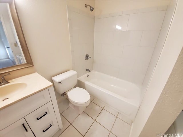 full bathroom featuring toilet, vanity, tile patterned flooring, and tiled shower / bath