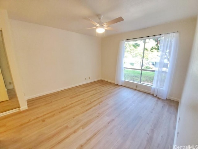 spare room with ceiling fan and light hardwood / wood-style floors