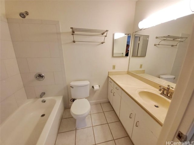 full bathroom with toilet, vanity, tile patterned flooring, and tiled shower / bath