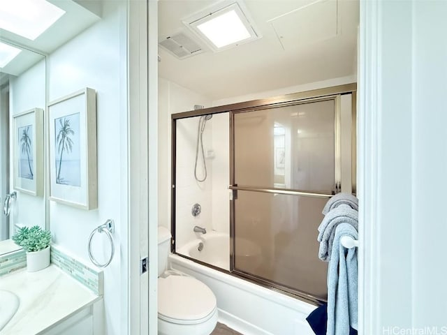 full bathroom with toilet, vanity, and combined bath / shower with glass door