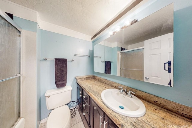 bathroom featuring crown molding, vanity, a textured ceiling, tile patterned floors, and walk in shower