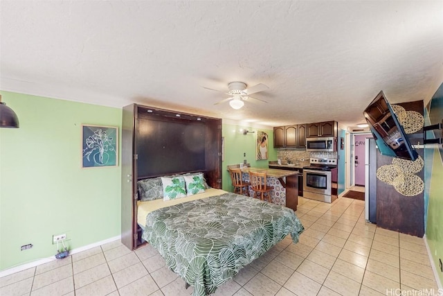 tiled bedroom featuring ceiling fan and a textured ceiling