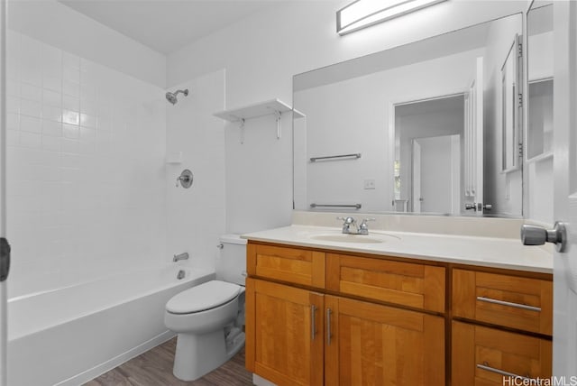 full bathroom with vanity, wood-type flooring,  shower combination, and toilet