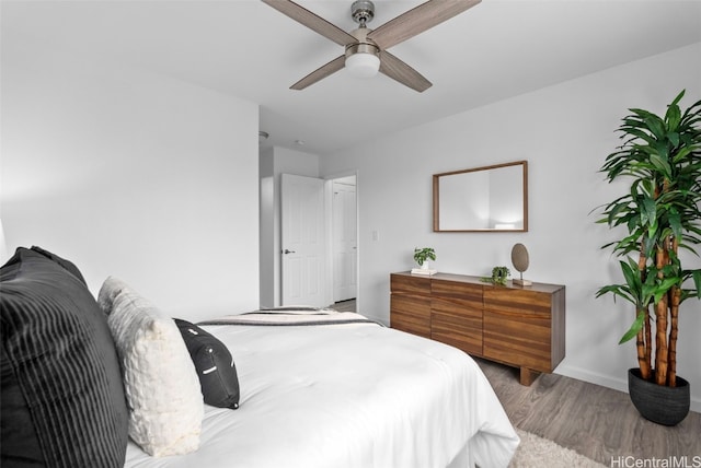 bedroom featuring ceiling fan and hardwood / wood-style floors