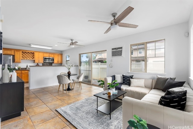 tiled living room with a wall mounted air conditioner and ceiling fan