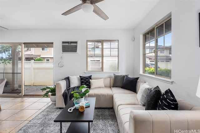 tiled living room with ceiling fan and a wall mounted AC