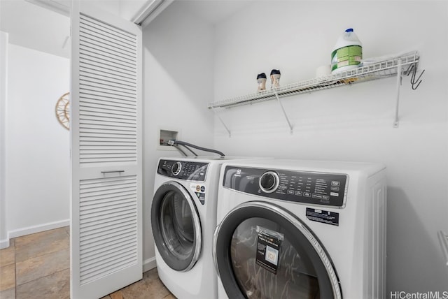 washroom featuring washing machine and dryer