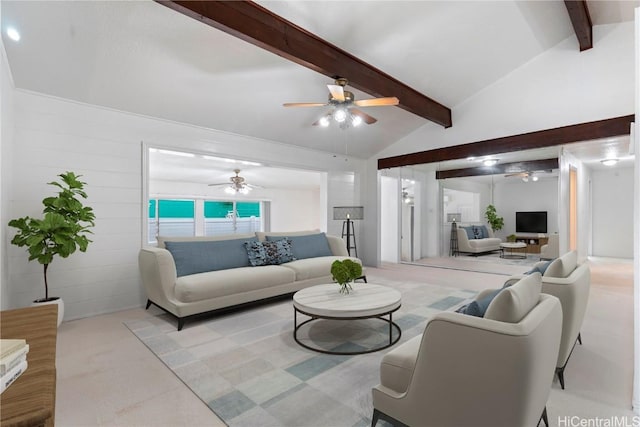 carpeted living room with lofted ceiling with beams