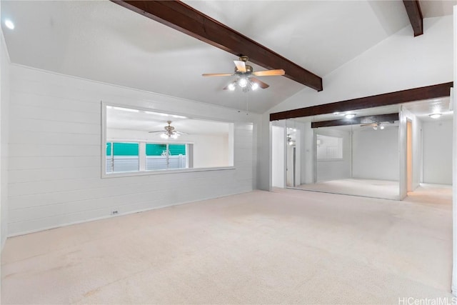 unfurnished living room featuring carpet flooring and lofted ceiling with beams