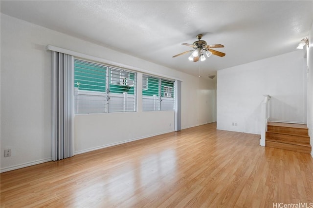 unfurnished room featuring ceiling fan and light wood-type flooring