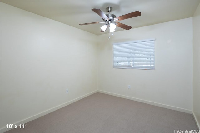 spare room featuring ceiling fan and carpet floors