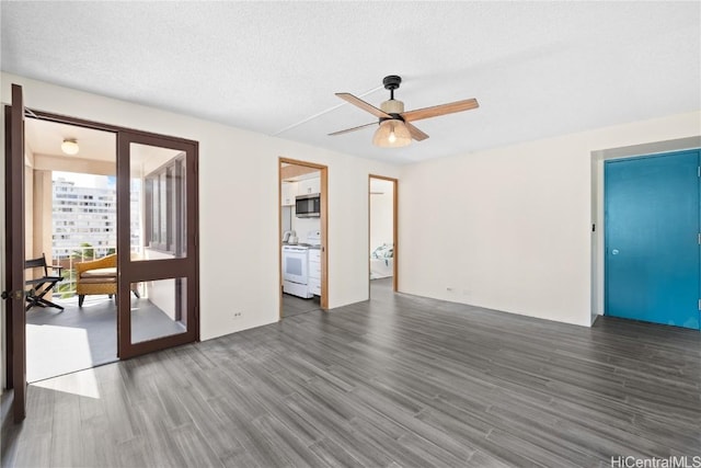 spare room featuring french doors, a textured ceiling, dark hardwood / wood-style floors, and ceiling fan