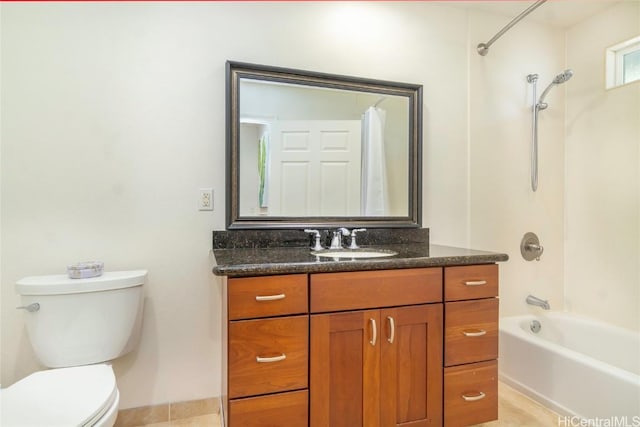 full bathroom featuring toilet, vanity, and bathtub / shower combination