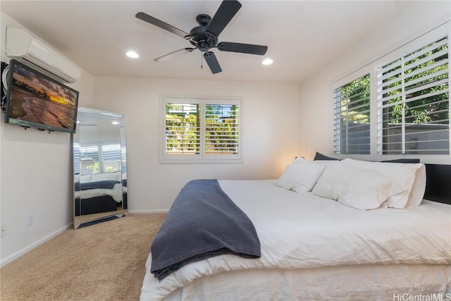 bedroom featuring ceiling fan, carpet, and a wall unit AC