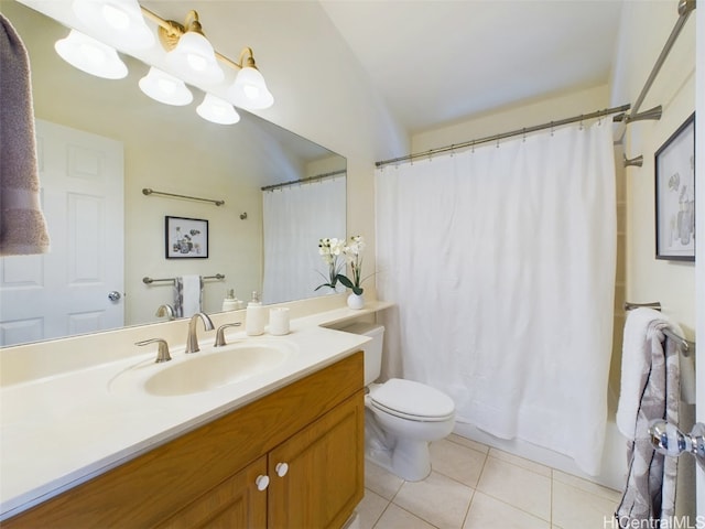 bathroom featuring tile patterned floors, vanity, and toilet