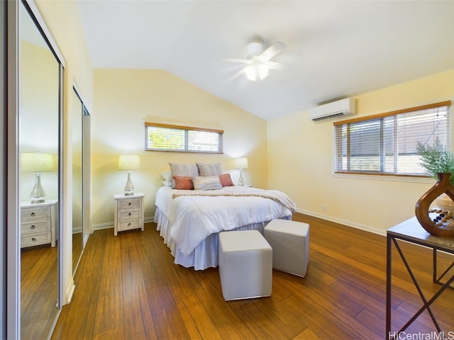 bedroom with a wall mounted air conditioner, dark hardwood / wood-style flooring, ceiling fan, and lofted ceiling