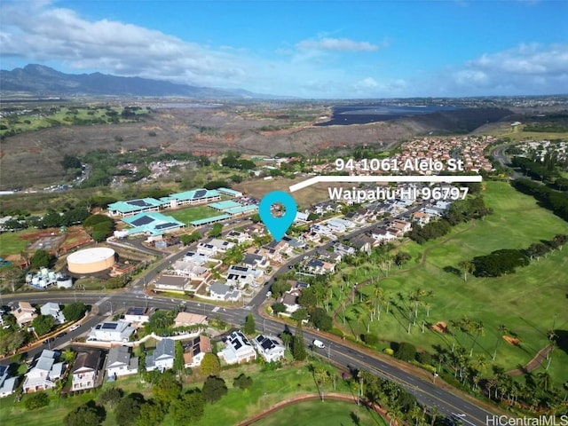 birds eye view of property featuring a mountain view