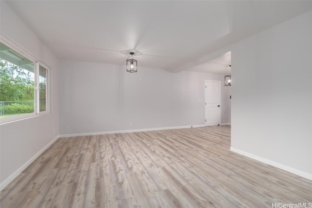 unfurnished room with light hardwood / wood-style floors