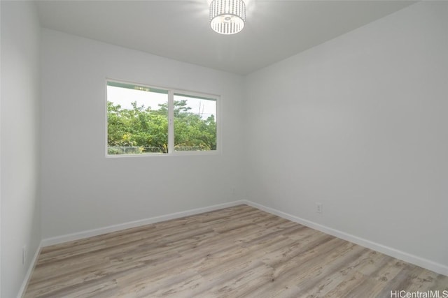 spare room featuring light wood-type flooring