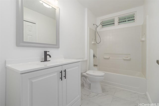 full bathroom featuring toilet, vanity, and washtub / shower combination