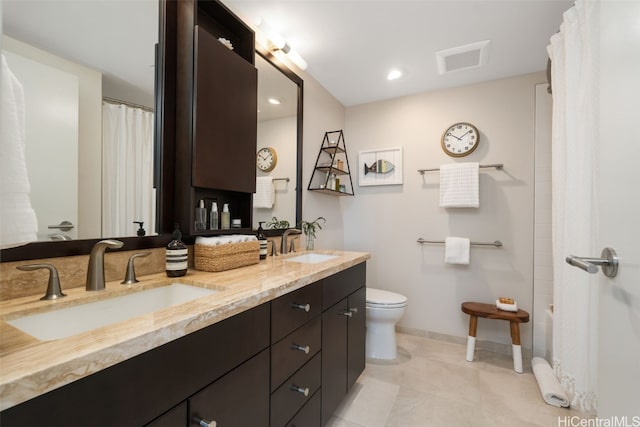 bathroom with tile patterned floors, vanity, toilet, and a shower with shower curtain