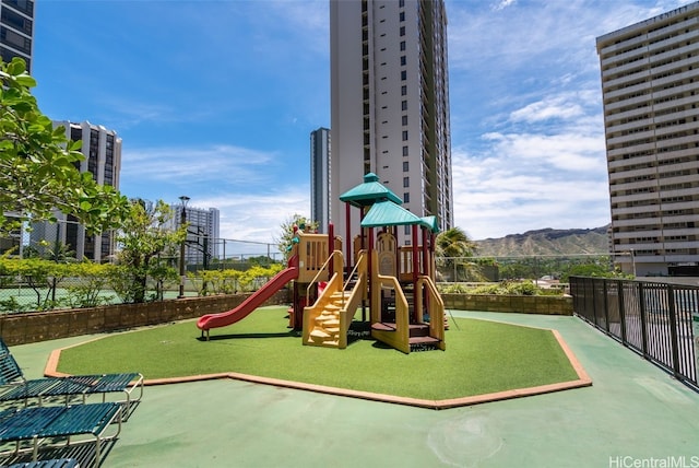 view of playground with a mountain view