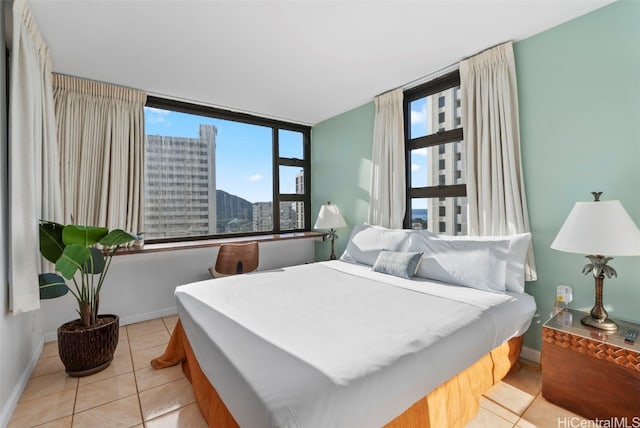 bedroom featuring light tile patterned flooring