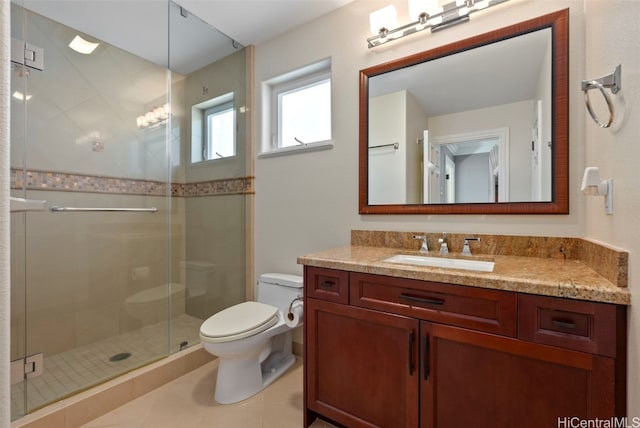 bathroom with a shower with shower door, tile patterned floors, toilet, and vanity