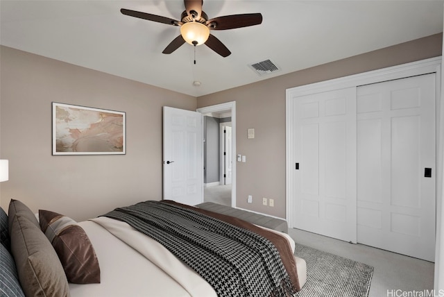 bedroom featuring ceiling fan and a closet