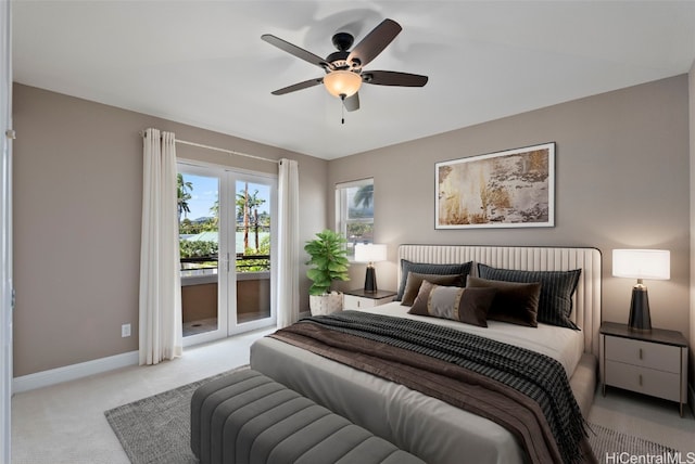 carpeted bedroom featuring ceiling fan and access to exterior