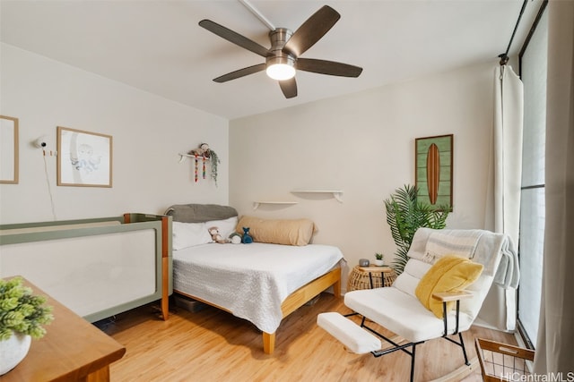 bedroom featuring ceiling fan and hardwood / wood-style flooring