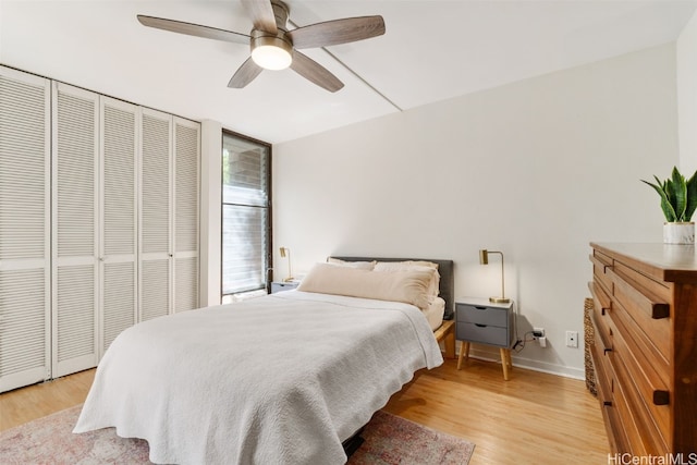 bedroom with ceiling fan, a closet, and light wood-type flooring