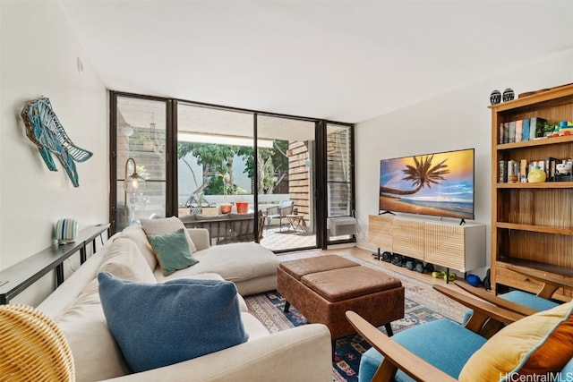 living room featuring floor to ceiling windows