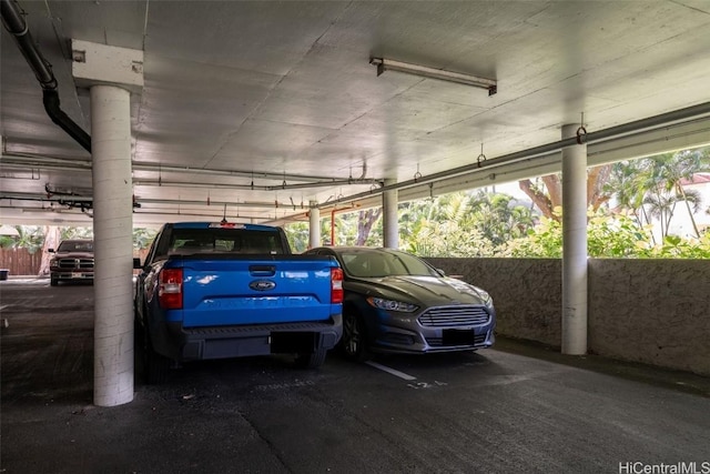 garage featuring a carport