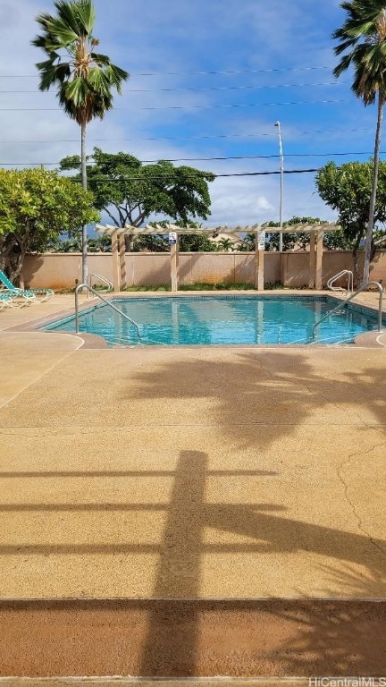 view of swimming pool with a patio