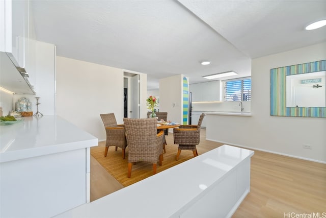 dining space featuring light hardwood / wood-style floors