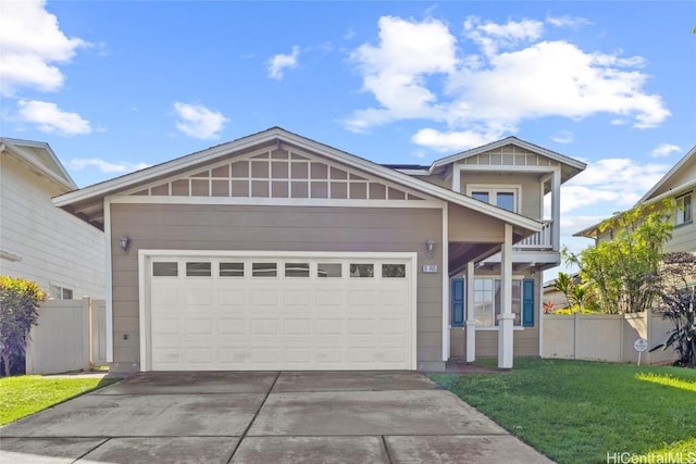 view of front of property with a front lawn, a balcony, and a garage