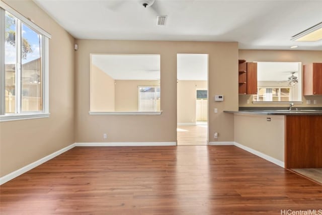 unfurnished living room featuring hardwood / wood-style flooring