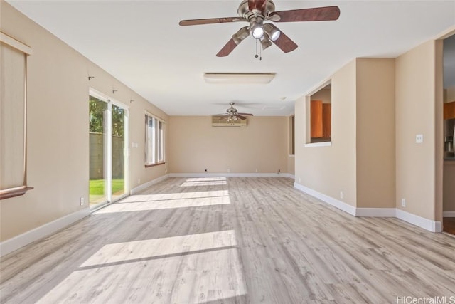 empty room featuring ceiling fan and light hardwood / wood-style flooring