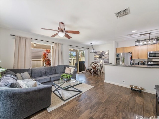 living room with dark hardwood / wood-style floors and ceiling fan