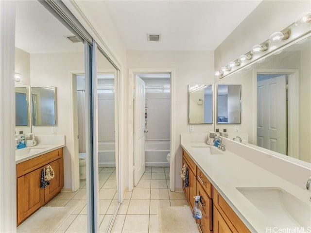 full bathroom featuring tile patterned flooring, vanity, shower / bathing tub combination, and toilet