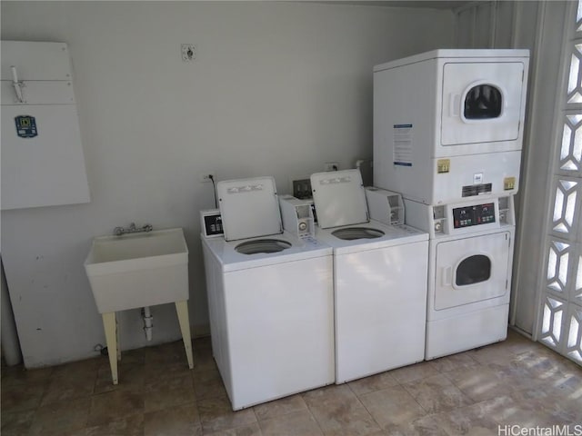 clothes washing area with separate washer and dryer and stacked washer / drying machine