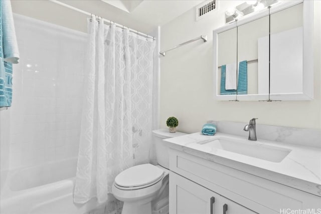 full bathroom with shower / bath combination with curtain, vanity, and toilet